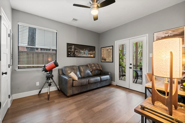 living room featuring french doors, ceiling fan, and hardwood / wood-style floors