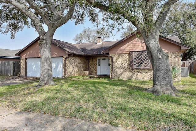 single story home with central AC, fence, an attached garage, brick siding, and a chimney