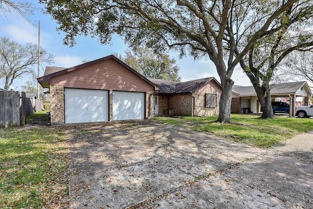 ranch-style house with a garage, brick siding, driveway, and fence