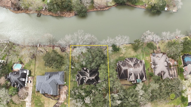 birds eye view of property featuring a water view