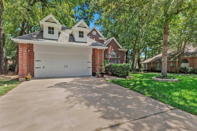 view of front of home featuring a garage and a front yard