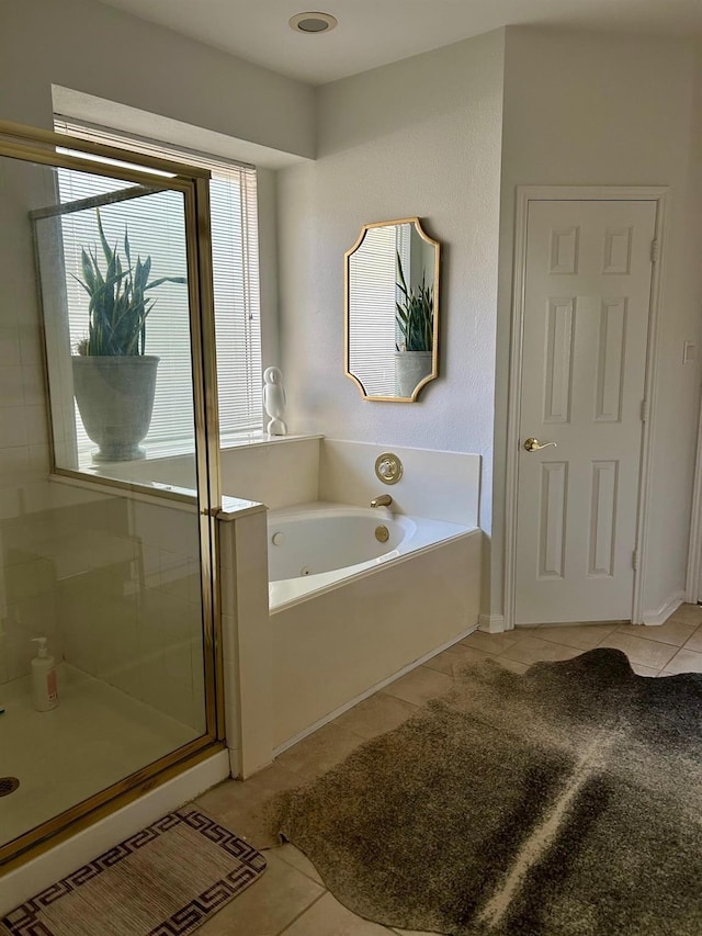 bathroom featuring tile patterned floors and plus walk in shower