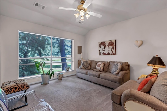 living room featuring lofted ceiling, carpet floors, and ceiling fan