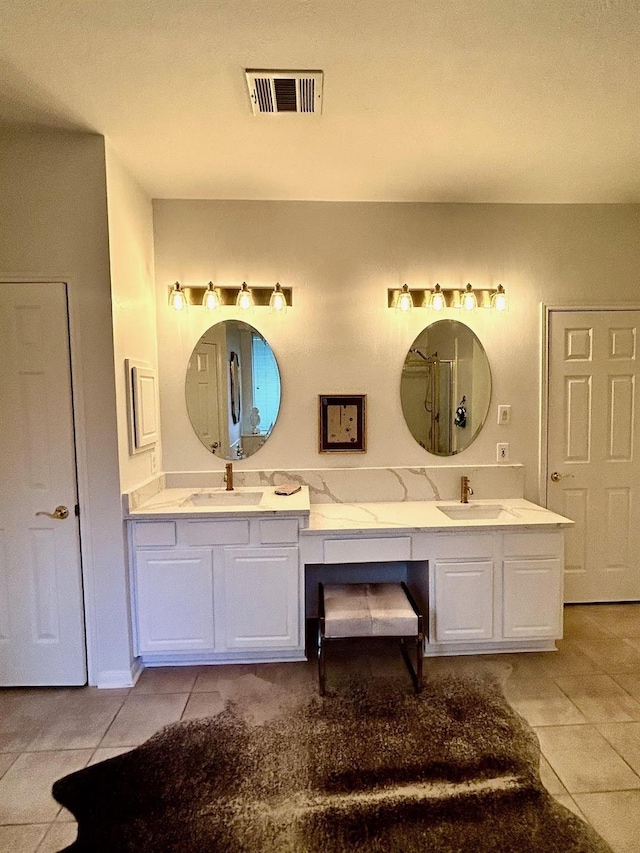 bathroom featuring vanity and tile patterned flooring