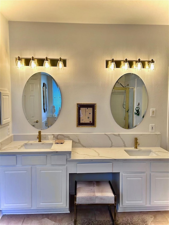 bathroom with walk in shower and vanity