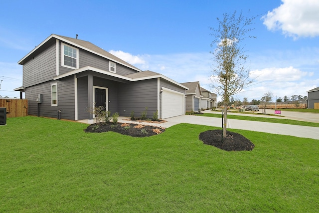 view of front facade featuring driveway, a front lawn, an attached garage, and fence