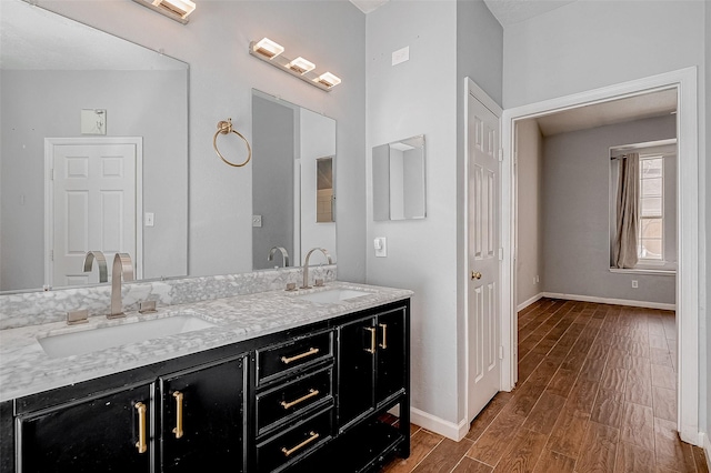 bathroom featuring vanity and wood-type flooring