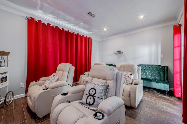 cinema featuring dark hardwood / wood-style flooring and ornamental molding