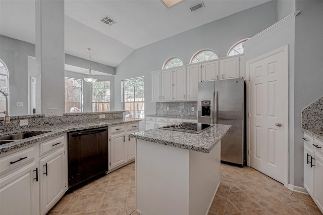 kitchen with stainless steel fridge, dishwasher, a kitchen island, and white cabinets