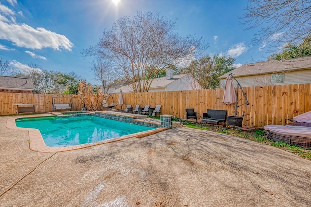 view of swimming pool featuring a patio area