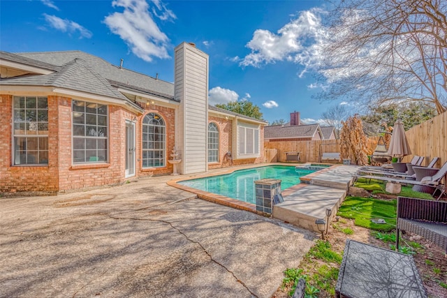 view of swimming pool featuring a patio