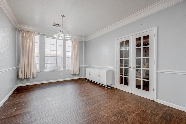 spare room with ornamental molding and dark wood-type flooring