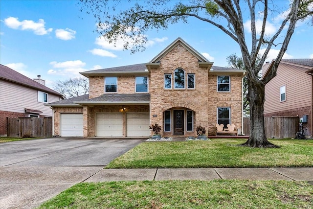 front of property featuring a front yard and a garage