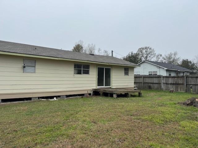 rear view of house with a lawn