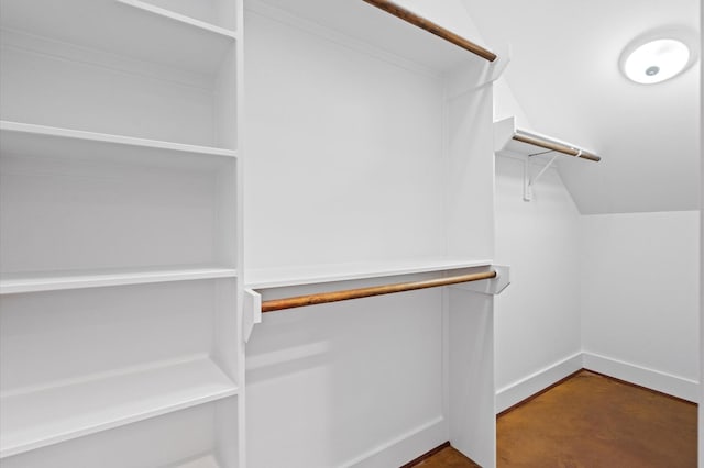 walk in closet featuring lofted ceiling