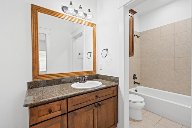 full bathroom featuring tile patterned floors, toilet, tiled shower / bath combo, and vanity