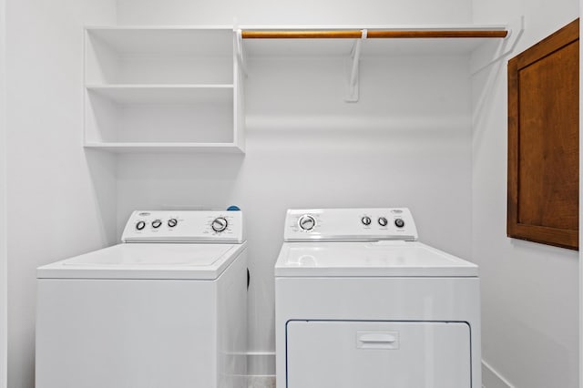 laundry area with washing machine and clothes dryer