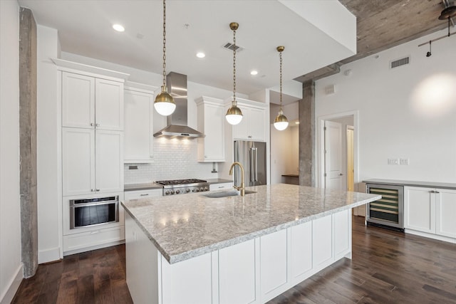 1714 Ashland Unit 303, Houston, TX 77008 - kitchen featuring visible vents, appliances with stainless steel finishes, a sink, wine cooler, and wall chimney exhaust hood