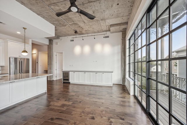 1714 Ashland Unit 303, Houston, TX 77008 - unfurnished living room featuring wine cooler, a ceiling fan, dark wood-style flooring, and visible vents