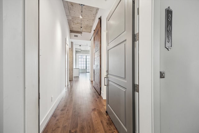 1714 Ashland Unit 303, Houston, TX 77008 - corridor with baseboards, dark wood-style floors, and a barn door