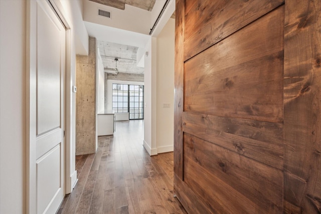 1714 Ashland Unit 303, Houston, TX 77008 - hall featuring visible vents, dark wood-style flooring, and baseboards