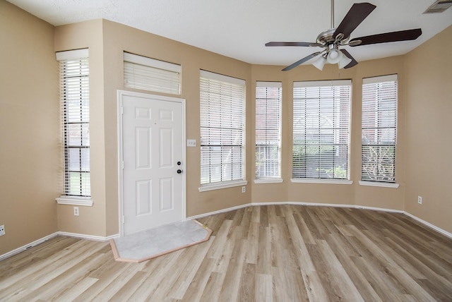 foyer entrance featuring ceiling fan and light hardwood / wood-style flooring