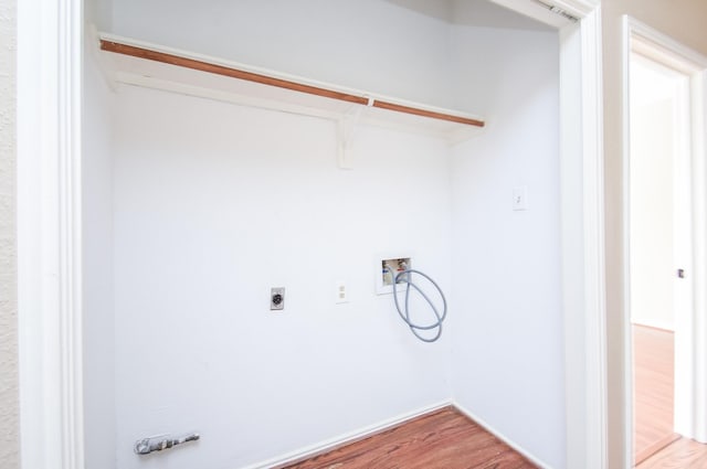 washroom featuring hardwood / wood-style flooring and washer hookup