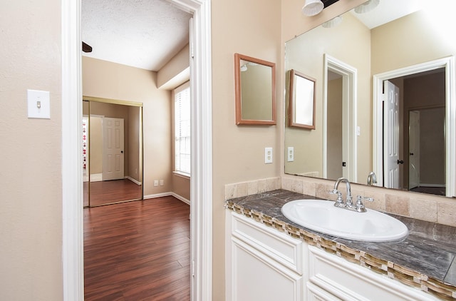 bathroom featuring hardwood / wood-style flooring and vanity