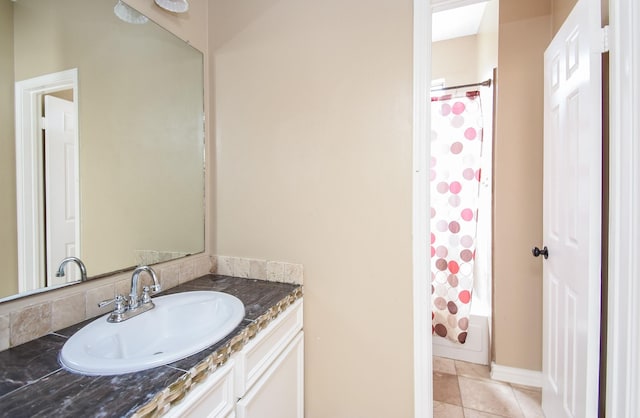 bathroom featuring vanity, tile patterned floors, and shower / bath combo with shower curtain