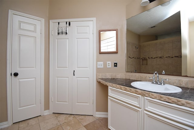 bathroom featuring tile patterned floors and vanity