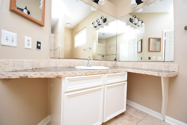 bathroom featuring tile patterned floors and vanity