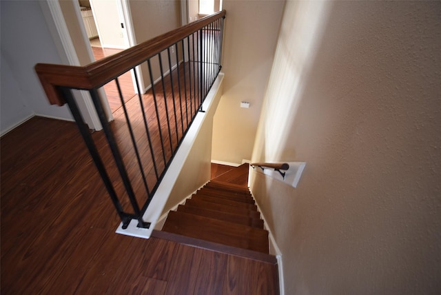 stairway featuring hardwood / wood-style flooring