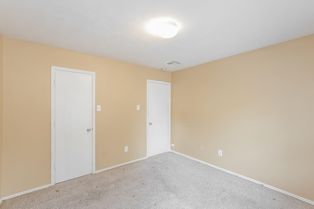 spare room featuring carpet flooring