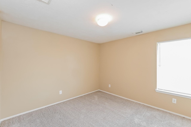 empty room featuring carpet flooring