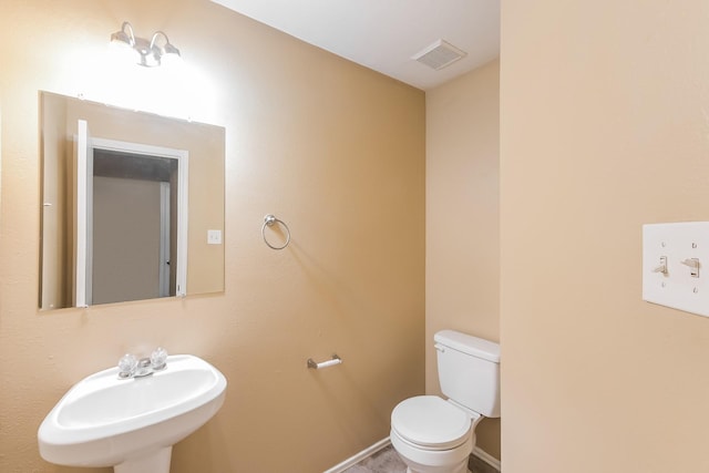 bathroom with sink and toilet