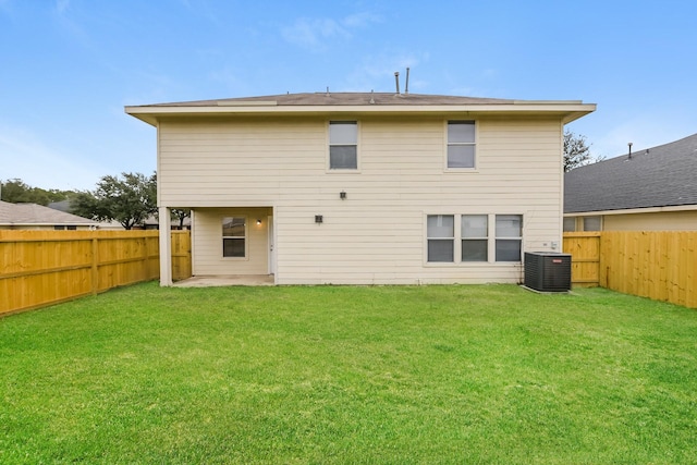 back of property featuring a yard, a patio, and central air condition unit