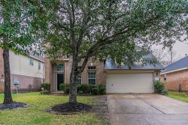 view of front of house featuring a garage and a front lawn