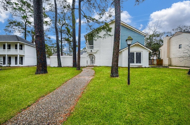 view of property exterior with a yard