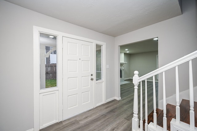 foyer entrance featuring hardwood / wood-style floors