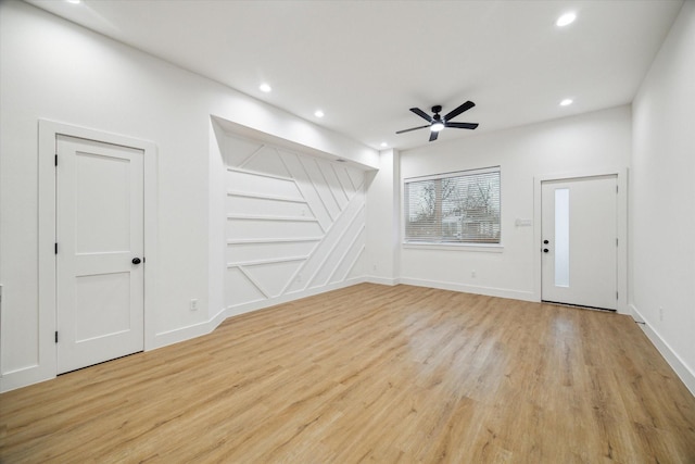 unfurnished living room featuring light wood-style floors, recessed lighting, ceiling fan, and baseboards