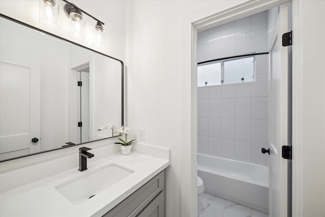 full bath featuring toilet, marble finish floor, bathing tub / shower combination, and vanity