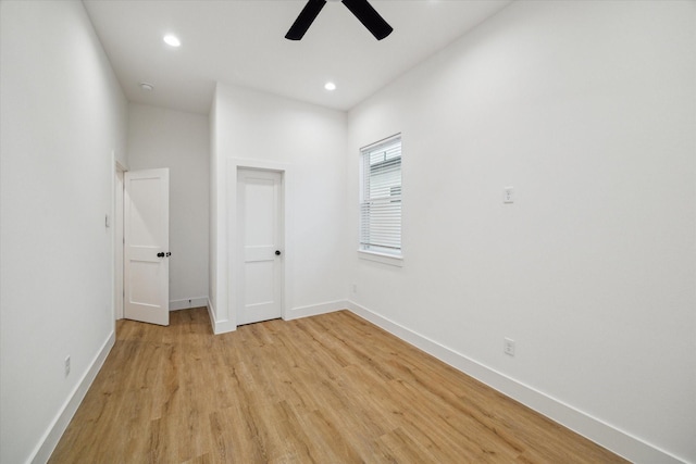 unfurnished bedroom featuring light wood-style flooring, baseboards, ceiling fan, and recessed lighting