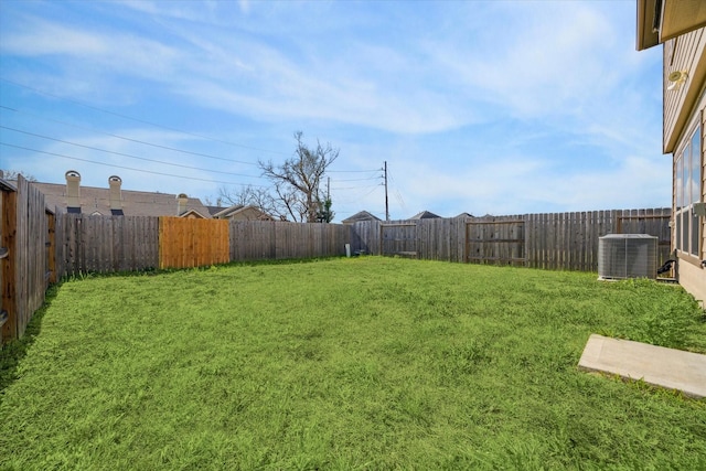 view of yard featuring central AC