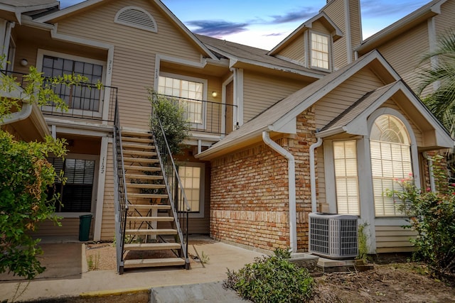 exterior entry at dusk with cooling unit