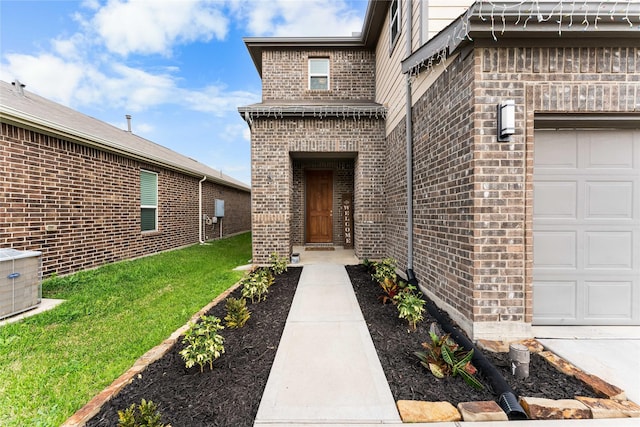 property entrance with central AC unit and a lawn