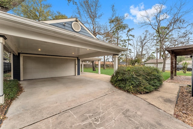 view of property exterior featuring a garage and driveway