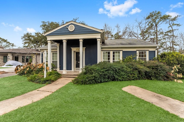 greek revival house featuring a front lawn