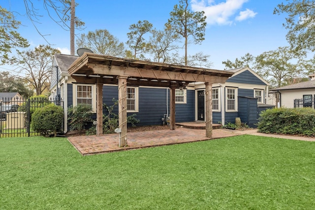 rear view of house featuring a pergola, a patio area, fence, and a lawn