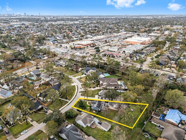 birds eye view of property with a residential view