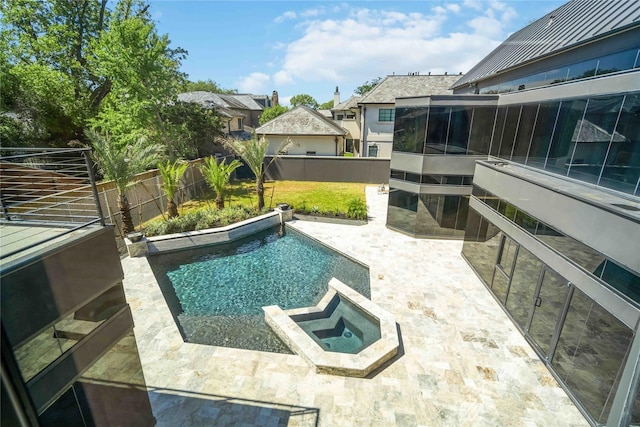 view of swimming pool featuring an in ground hot tub